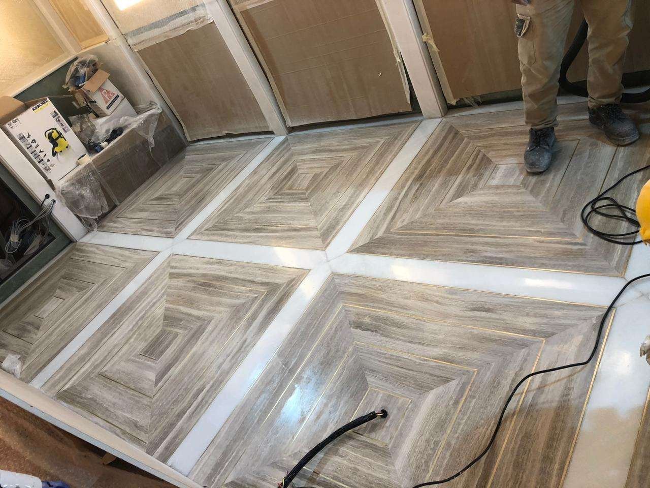 Completed geometric natural stone floor during final site work