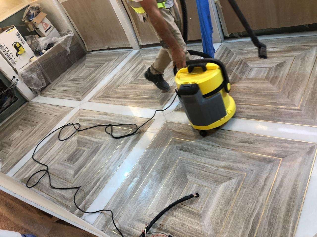 Stone floor finishing work on a geometric patterned floor
